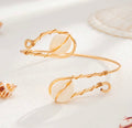 Bracelet de bras cauri doré - vue produit 1